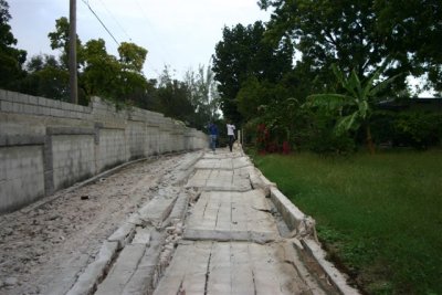 the whole wall has fell onto the road