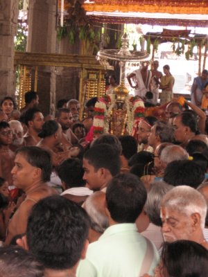 15-Parthasarathy Utsavam.Day 09.Mattai Adi Utsavam.Battar on behalf of Namazhwar pacifying the divine couple.jpg