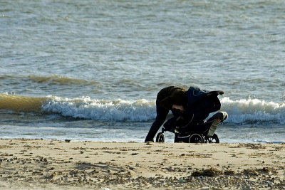 Father and child on a winter beach