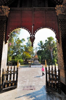 Golden stupa seen through the doors of  Wat Chieng Thong, Luang Prabang