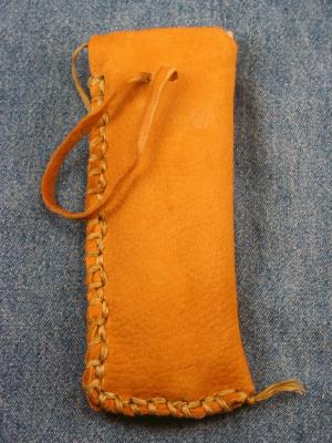 Strap pulls in or out of the sheath