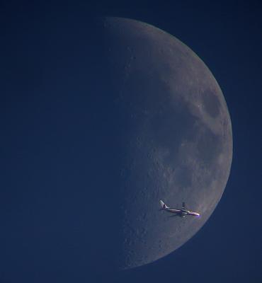 American Airline Plane in front of Moon