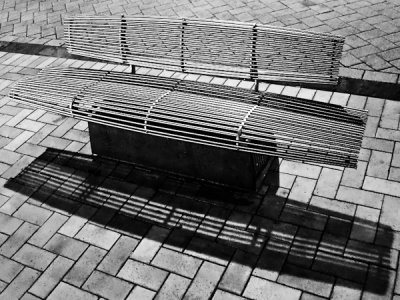 Steel bench under street lighting