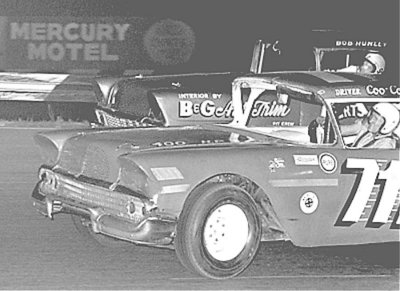 Driver Coo Coo Marlin battles the car driven by Bob Hunley 1964