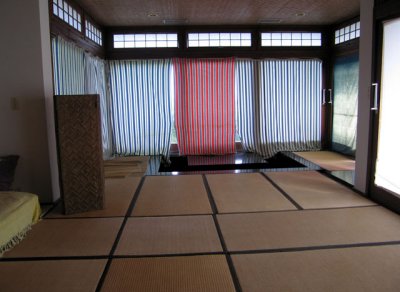 Sunken dining table at far end; tatami mats