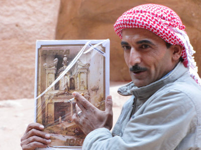 A guide compares Petra past w/ what they're seeing, Using David Robert's Yr-1839 drawings
