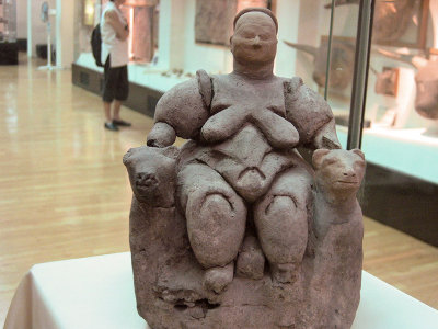 From Catal Hoyuk, this fertility figure (about 7,000 yrs old with 2 leopards at her
side (and some say, giving birth here), is the most well-known figure of its type. Goddess 
of Beasts, she developed later into Artemis.

This carving in baked clay was unearthed by archeologist James Mellaart in 1961.

Excellent ongoing-excavations site.
Interesting article by Alvino.
See another version from Catal Huyuk in a photo by Lillian Bennett.

