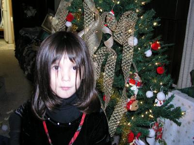 Sarah in front of our Christmas tree