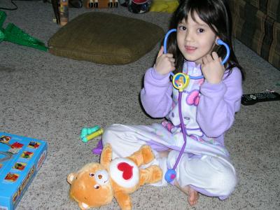Sarah playing with her Care Bear Dr.'s Kit