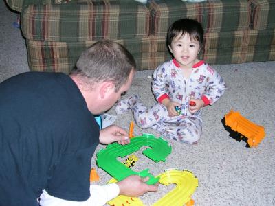 Daddy helping put together Kyle's Thomas Train Set