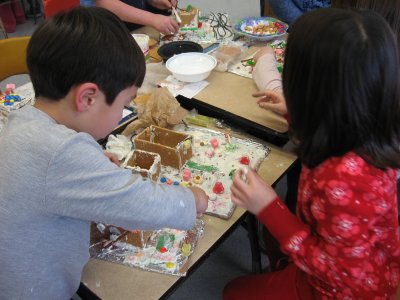 Kyle and Sarah making gingerbread houses