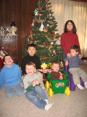 Austin, Kyle, Ryan, Alex, Sarah, and Noah gathered 'round the Christmas tree