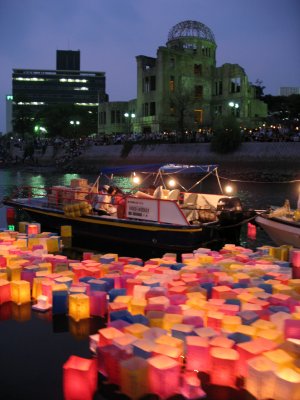 Peace Lanterns moving upstream after nightfall
