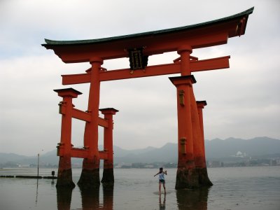 Girl wading out from the torii