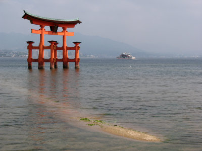 The great torii and passing ferry