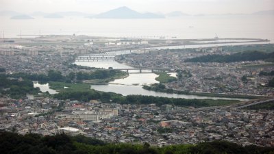 Distant curves of the river and hazy Inland Sea