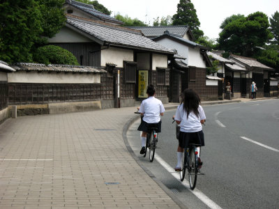 High schoolers riding down Shiomi Nawate
