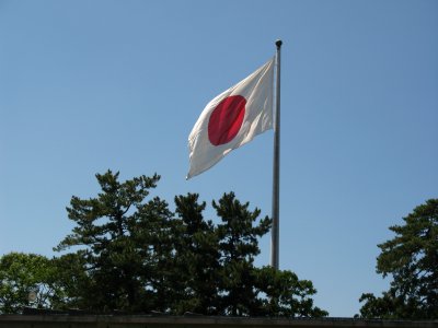 Giant Japanese national flag above the shrine