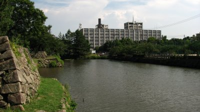 Old castle moat with distant Tottori Courthouse