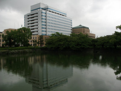 Modern buildings towering over the outer moat