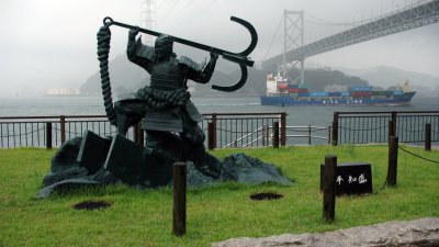 Statue of the Heike samurai with passing ship