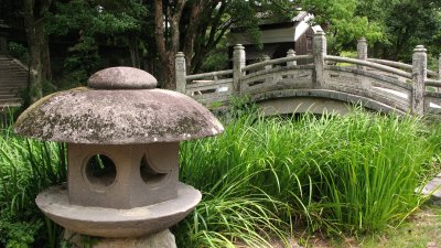 Stone lantern and bridge outside Shizukiyama-jinja