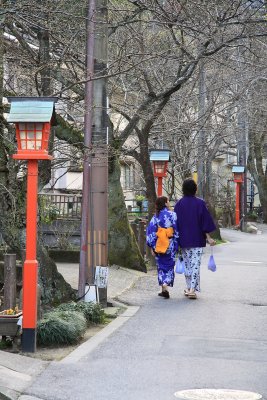 Young couple walking down a quiet backstreet
