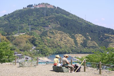 Ō-henro couple resting on the castle grounds