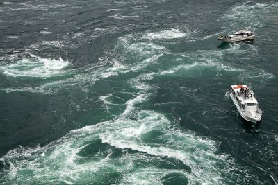 Trio of whirlpools with sightseeing boats