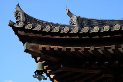 Roof detail with ornamental bell on the Kon-dō