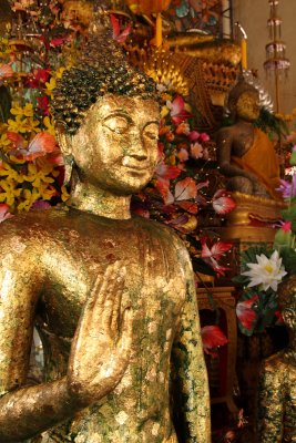 Gold leaf-decorated Buddha image in a temple