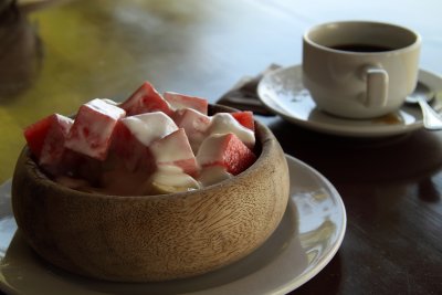 Fruit and yogurt bowl with coffee