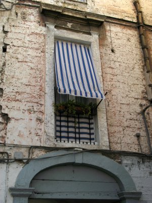 Covered window along an alley