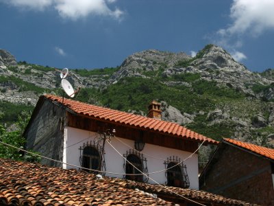 Rooftop of an old house against the mountains