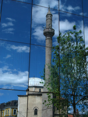 Charshi Mosque reflected in the Parliament building