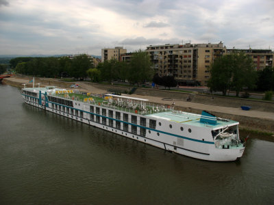 Boat on the Danube and nearby housing blocks