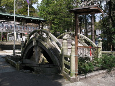 Old ornamental stone bridge at Haritsuna-jinja