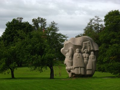 Folk characters on the back of a sculpture head