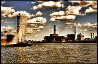 Waterfalls and smokestacks between Brooklyn and Manhattan Bridges