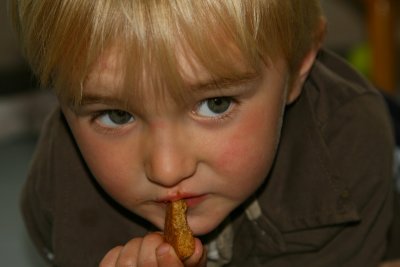 Zachary eating his Gingernut