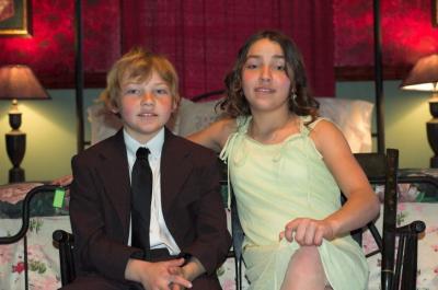 kids in hotel room on bench