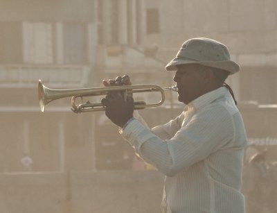 trumpeter in the fading sunset on the Malecon