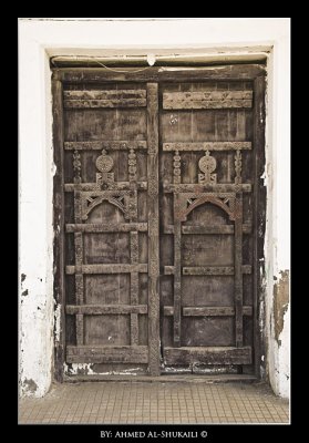 Old wooden door with handmade ornments