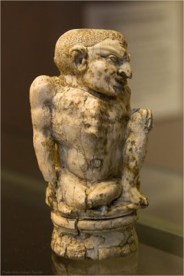 Carved ivory figure of a hunchback