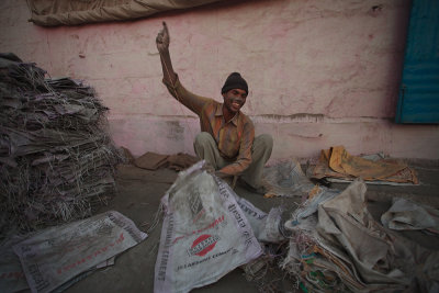 Mukesh, sewing concrete bags