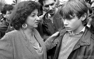 Dutch politician Tara Sing Farma talks to a student during a demonstration against nuclear weapons