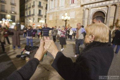 Dancing the traditional 'Sardana' at night in the streets of Barcelona, Spain