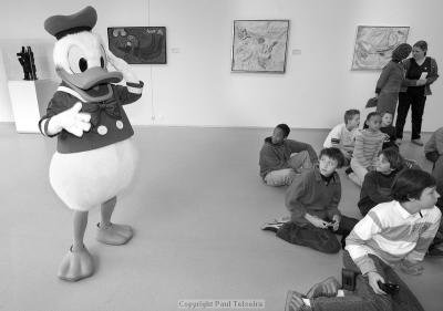 Donald Duck entertains the young exhibition guests in anticipation of the Mayors arrival.