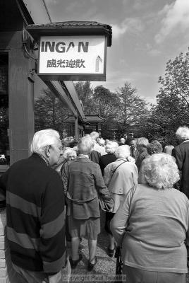 The hungry crowd gathers outside the Chinese restaurant 'Jasmijn' for the free lunch