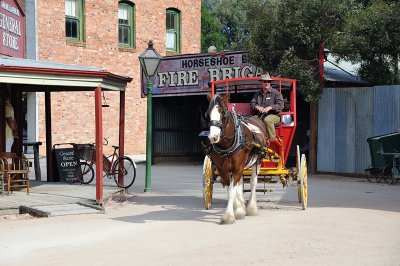 Horse and red coach